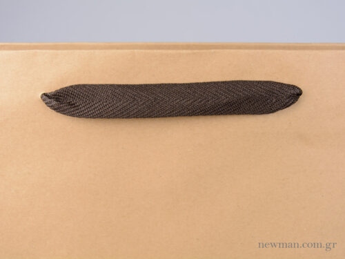 Kraft paper bag with herringbone ribbon handle in brown - details