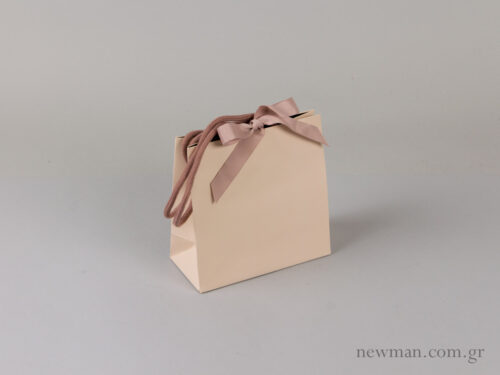Paper bag with cotton cord and grosgrain ribbon