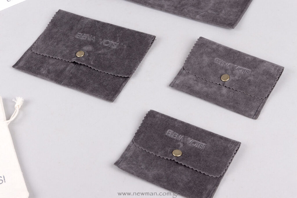 Custom grey suede jewellery pouches with logo