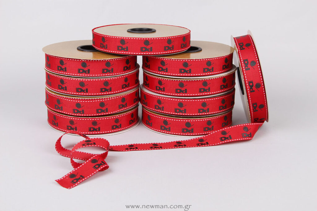 Black embossed printing on stitched grosgrain ribbon