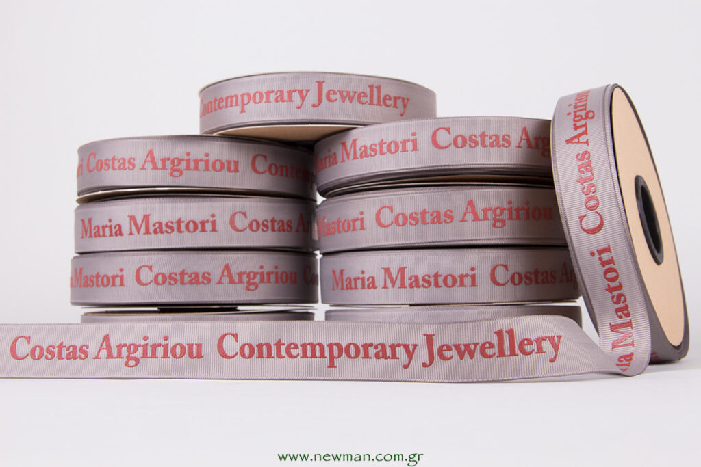 Grey gross robbon with red embossed silk screen printing with logo Maria Mastori Costas Argiriou Contemporary Jewellery