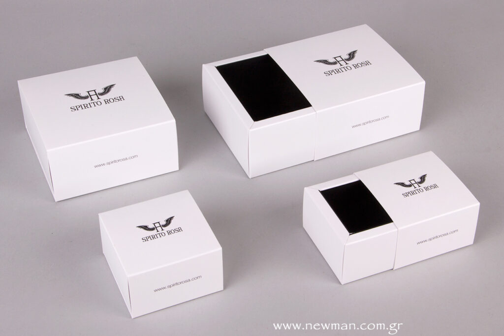 Two sizes of white sliding Jewellery Match Boxes with black printing and mat lamination, to create a smooth sliding movement and soft touch feeling.