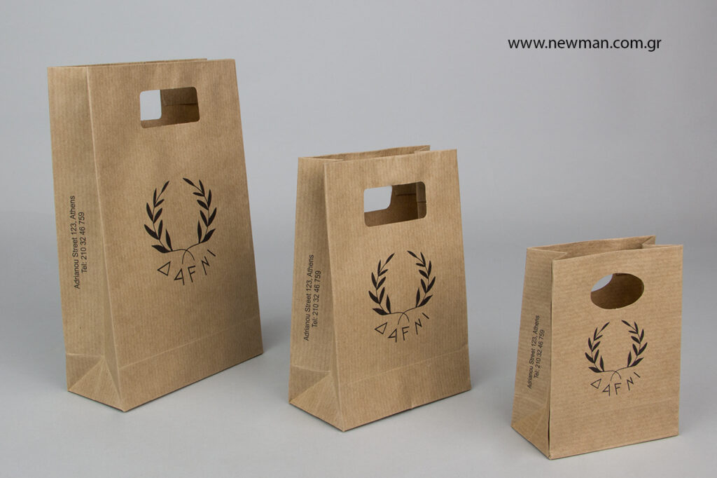 Printed logo on kraft paper bags with die-cut handle using silk screen technique.