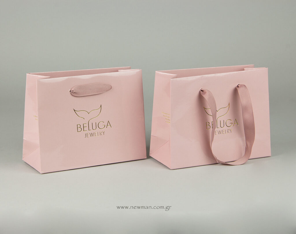 Luxury paper bags with gold hot-foil printing.