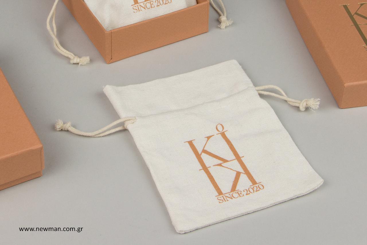 Cloth pouches with silk-screen printed logo.