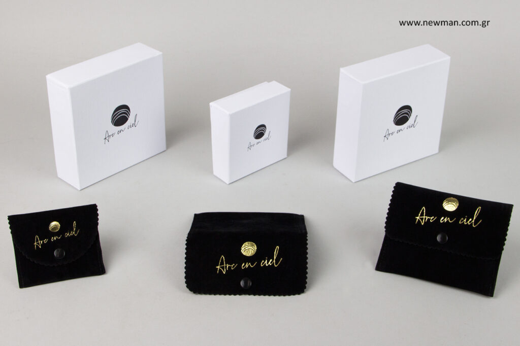 Suede jewellery cases with button and hot-foil printed logo.