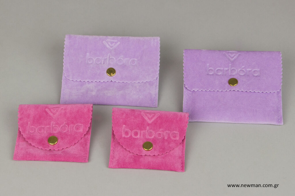 Debossed pocket-shaped pouches with button.
