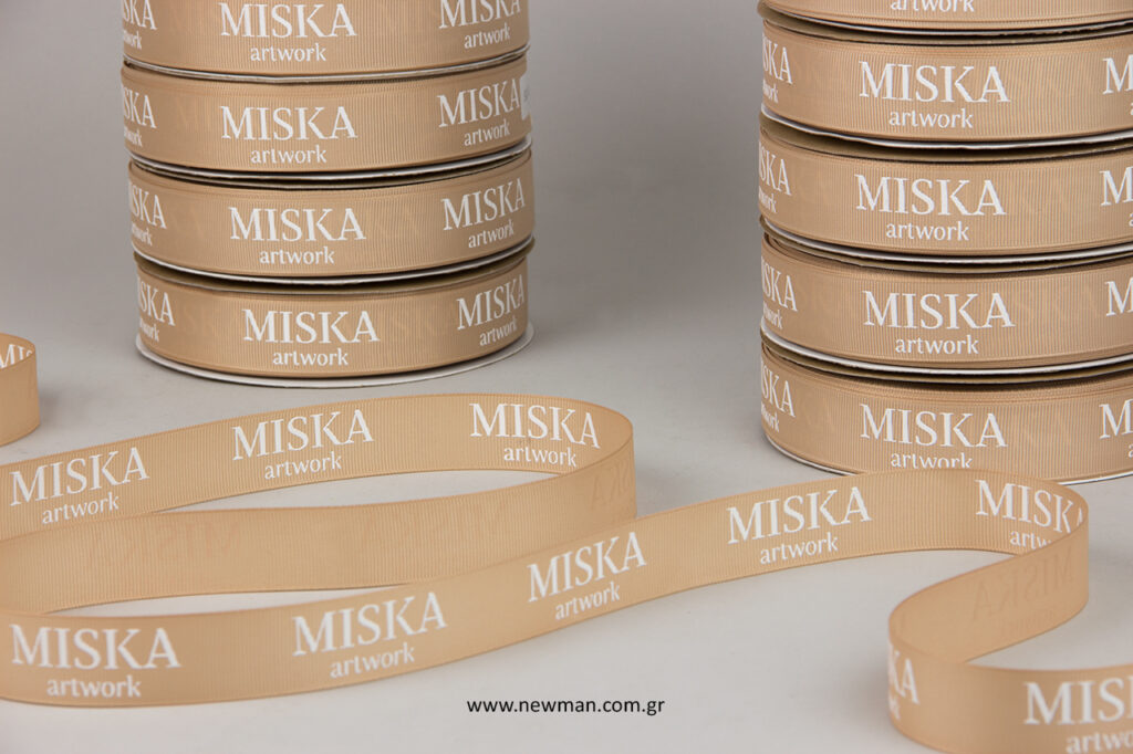 Printed wholesale ribbons with embossed silk-screen logo.