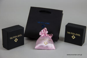 The posh jewel: Printed NewMan packaging with hot-foil logo.