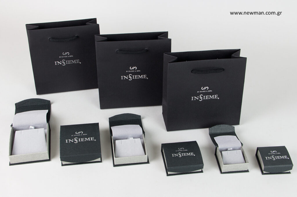 Insieme: Newman jewellery packaging with logo.
