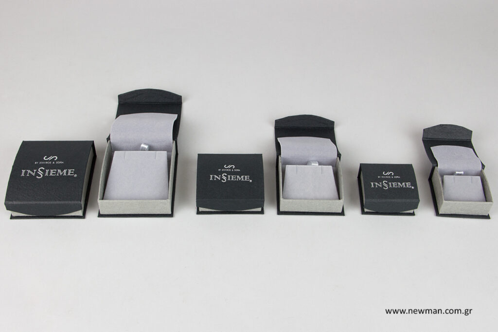 Printed jewellery boxes with silver hot foil logo.