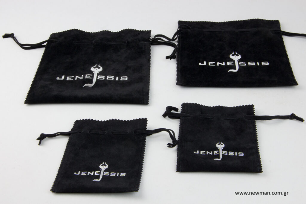 Jenessis: Silver hot-foil printed black pouches.