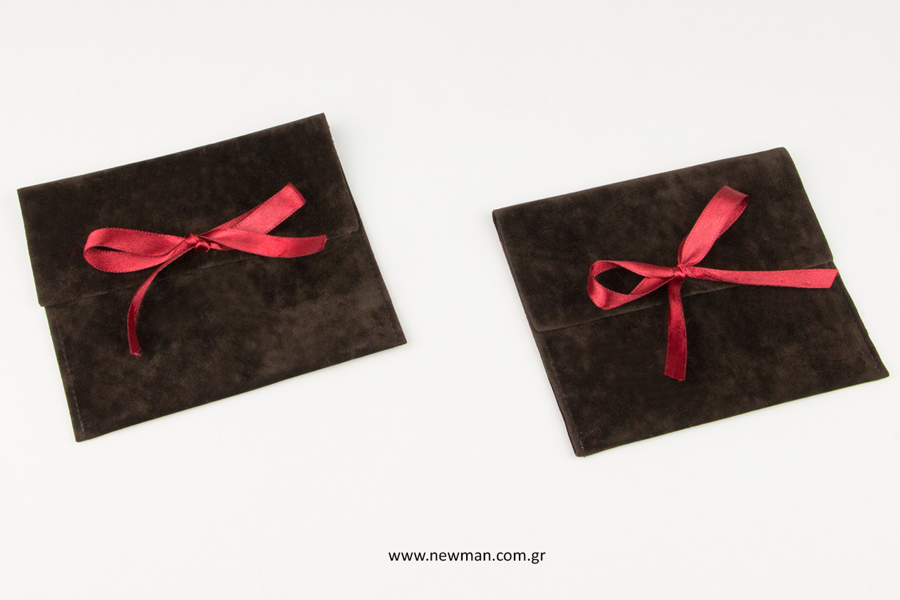 Printed jewellery cases with ribbon closure.