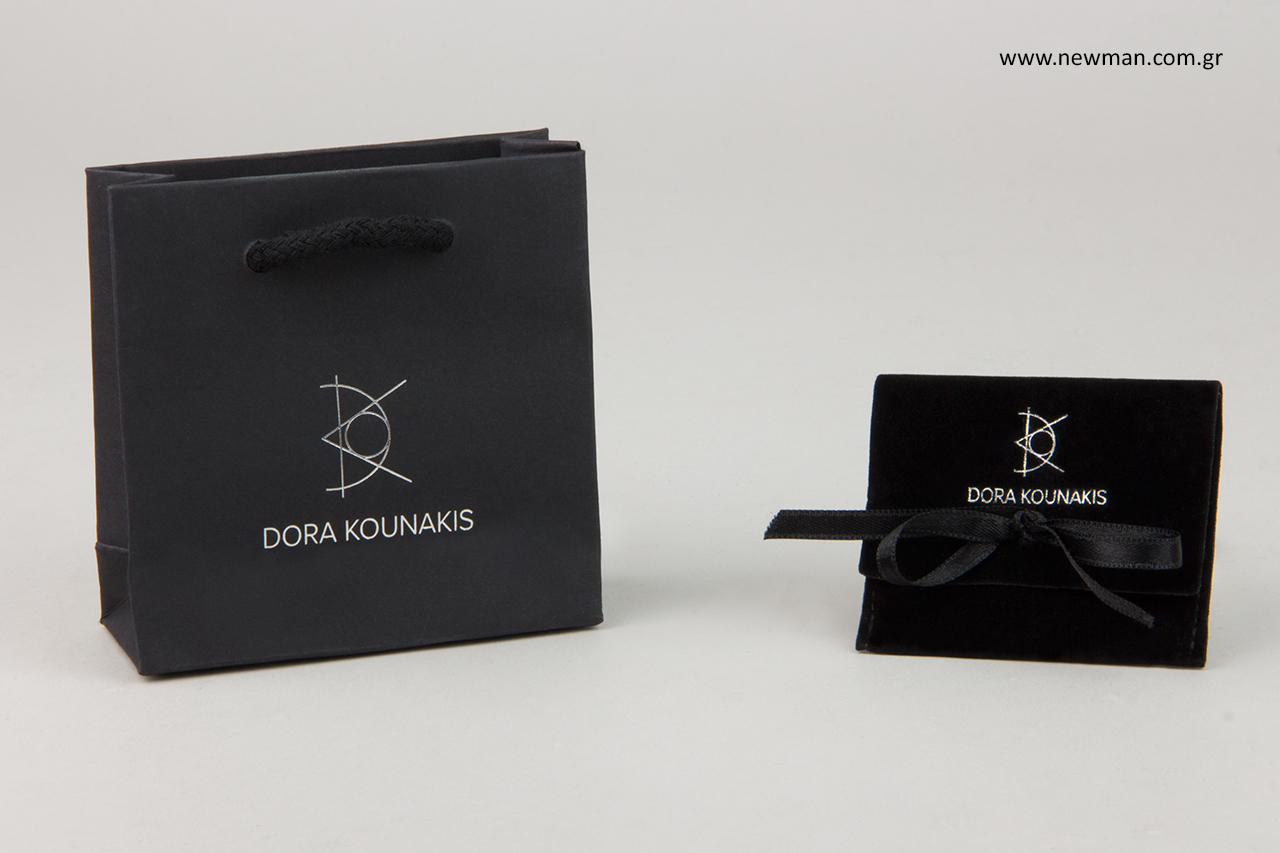 Jewellery bags and pouches with store’s brand name in silver hot-foil printing.