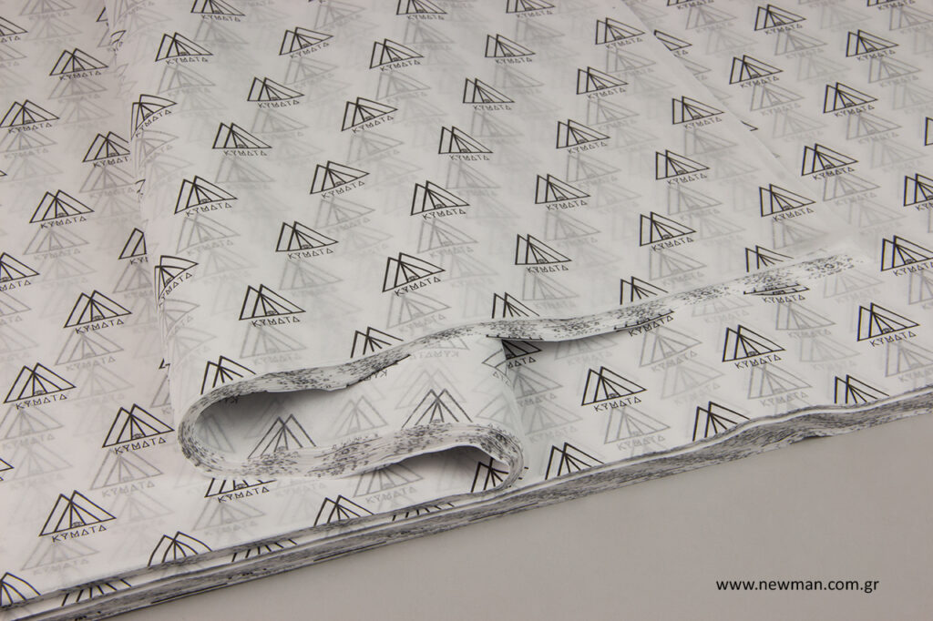 Kymata Jewels: Printed tissue paper with corporate brand name.