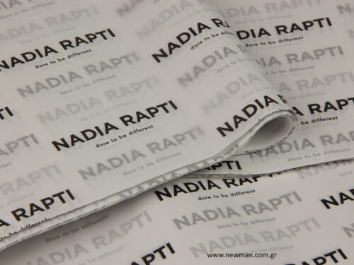 Nadia Rapti: Printed tissue paper with brand name.