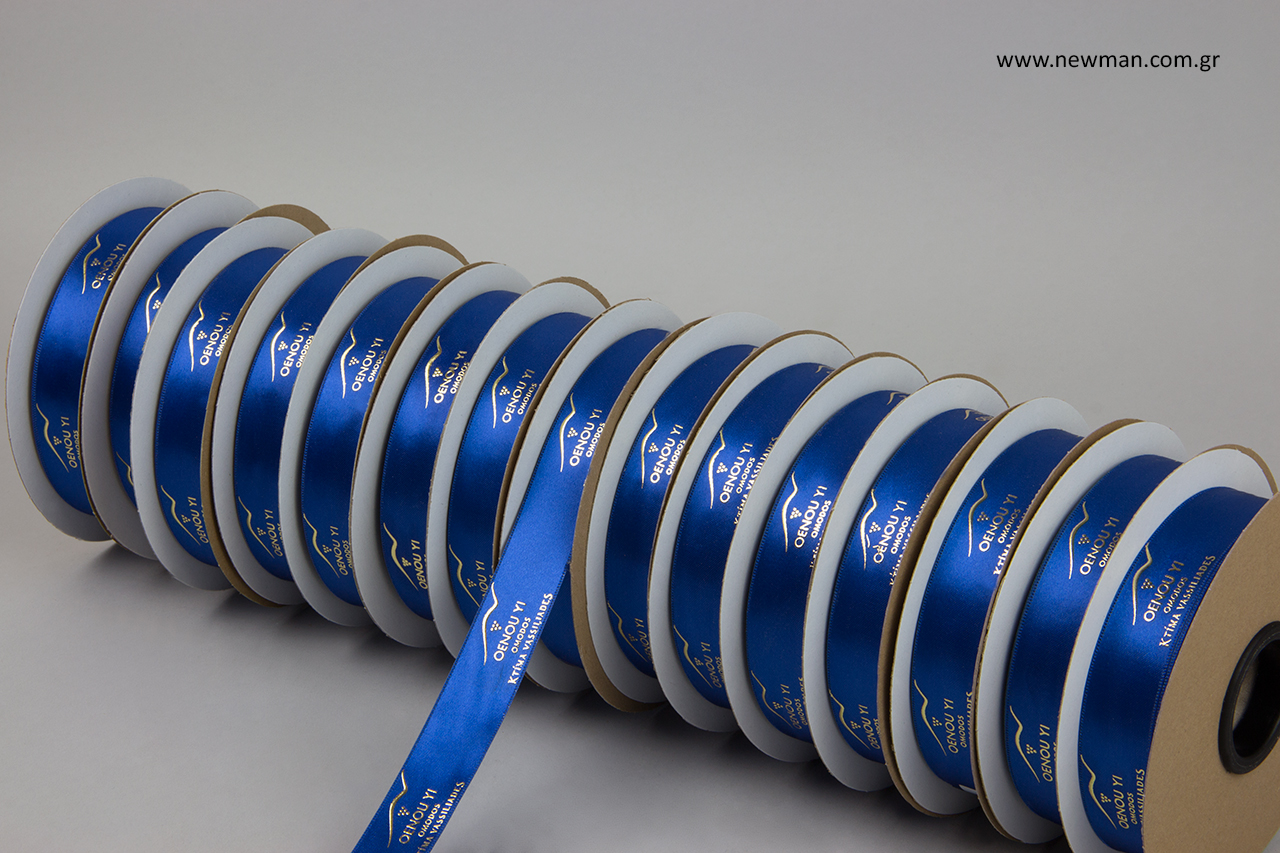 Royal blue double-faced luxury satin ribbon with embossed metallic gold printing.