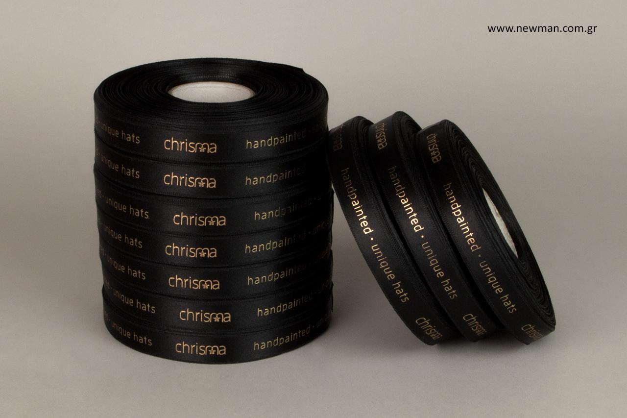 Branded ribbons with gold hot-foil printed logo.