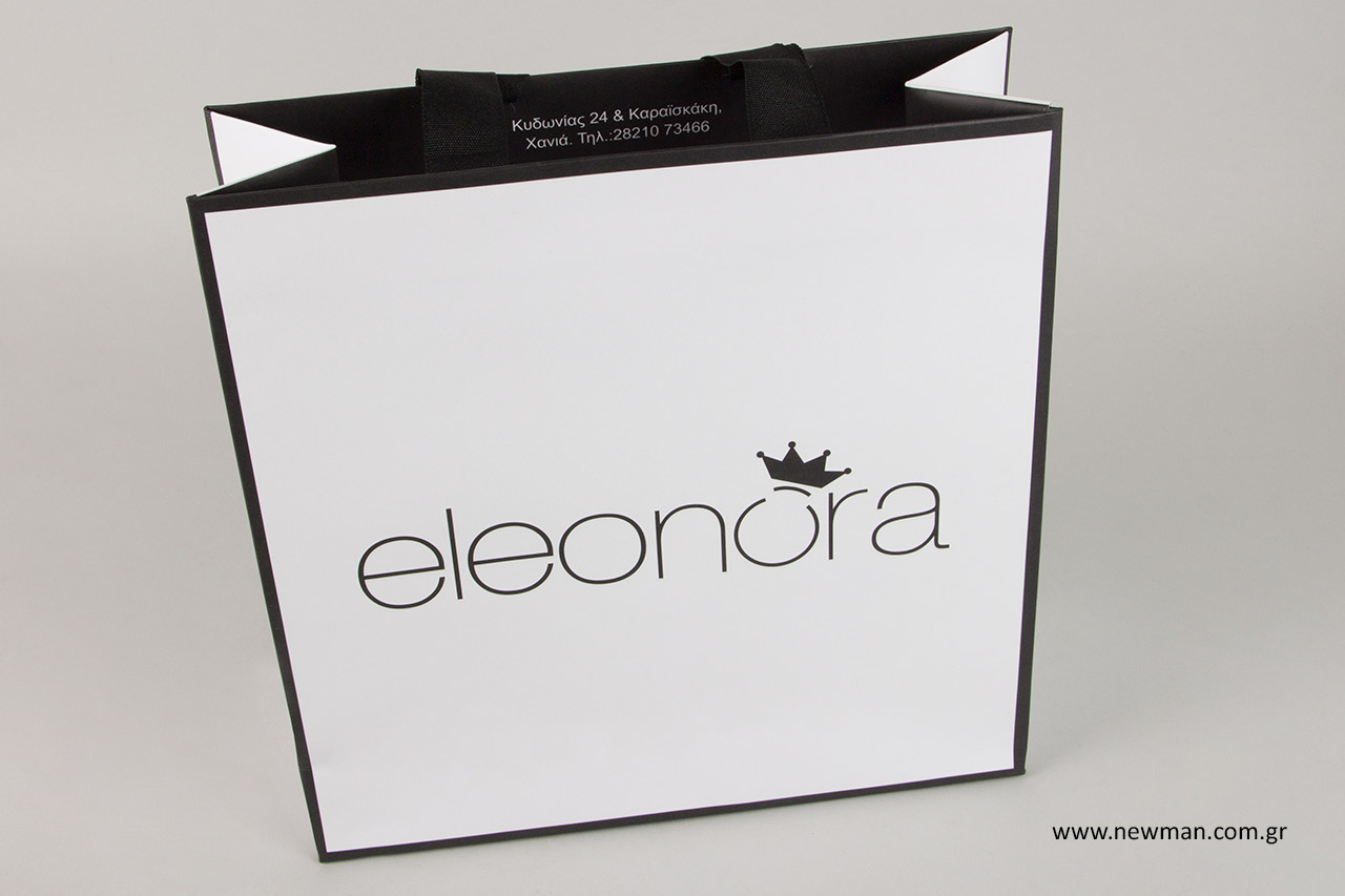 Black embossed print on carrier bags for stores.