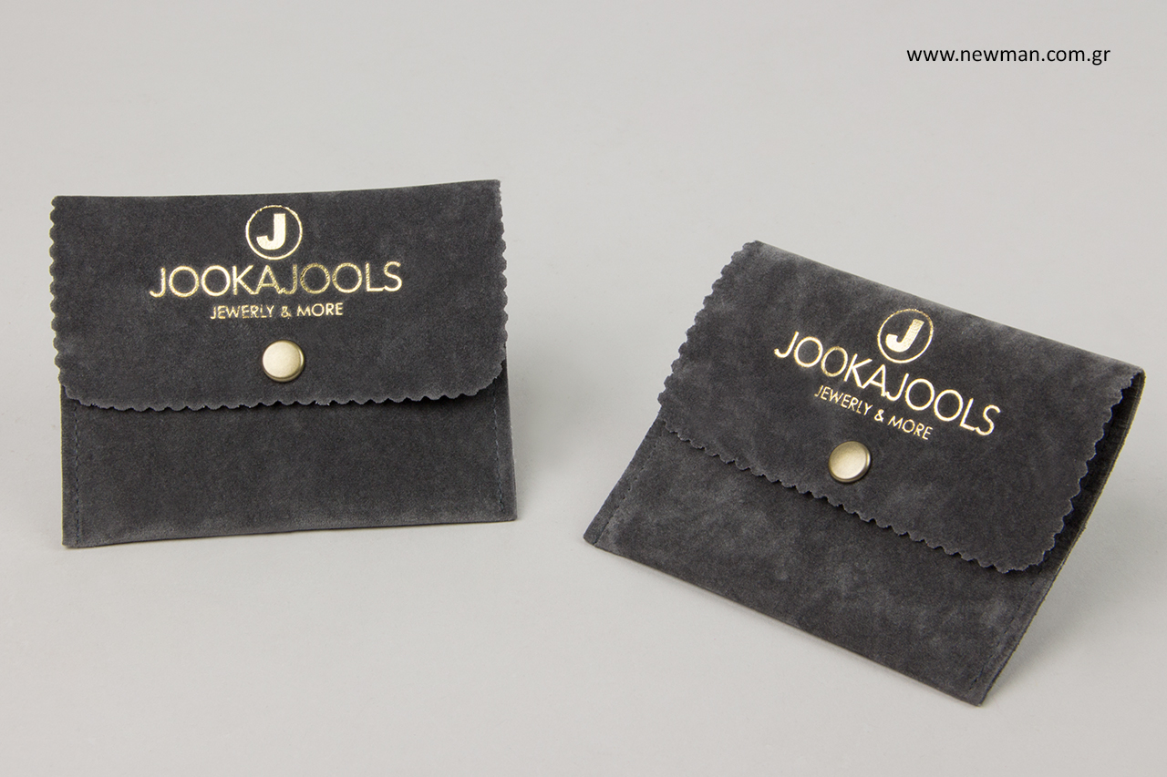 Printed suede cases with button for jewellery.