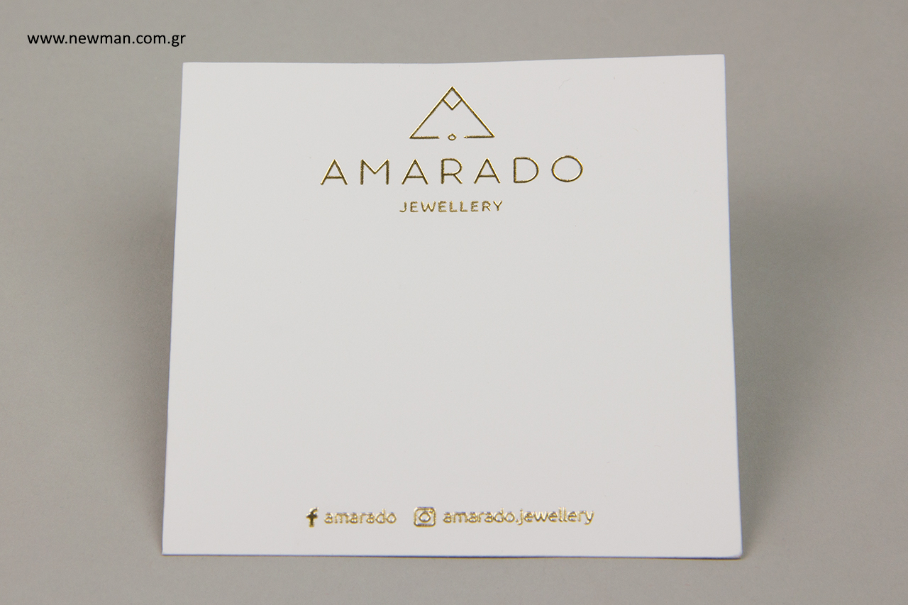 Gold print on white business cards.