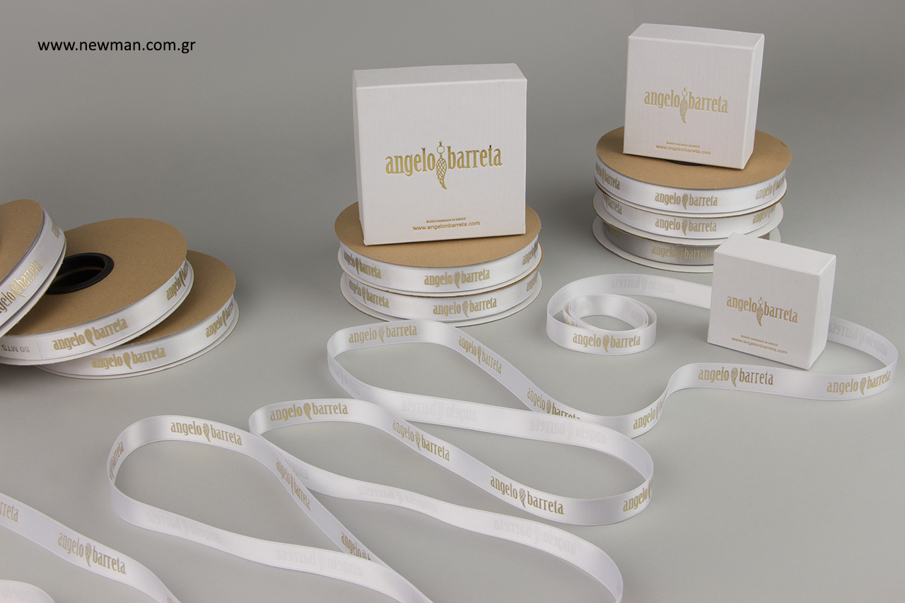 Branded ribbons with embossed metallic gold printing.