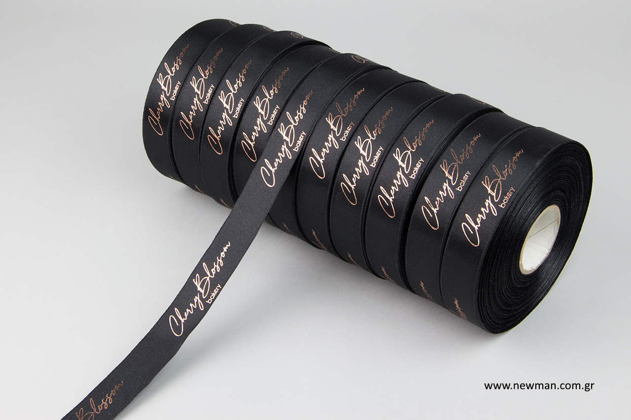 Wholesale branded ribbons with rose gold print.