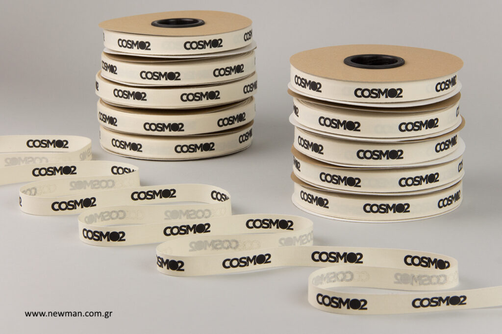 COSMO2: Printed cotton ribbon with brand name.