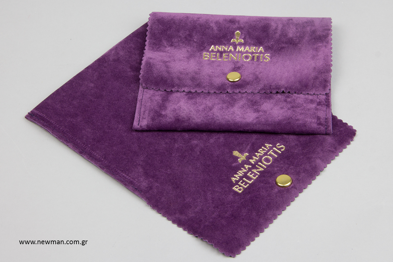 Gold hot-foil printing on purple suede jewellery pouches.