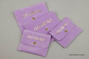 Alice Gone Mad: Pocket-shaped suede pouch with corporate name printing.