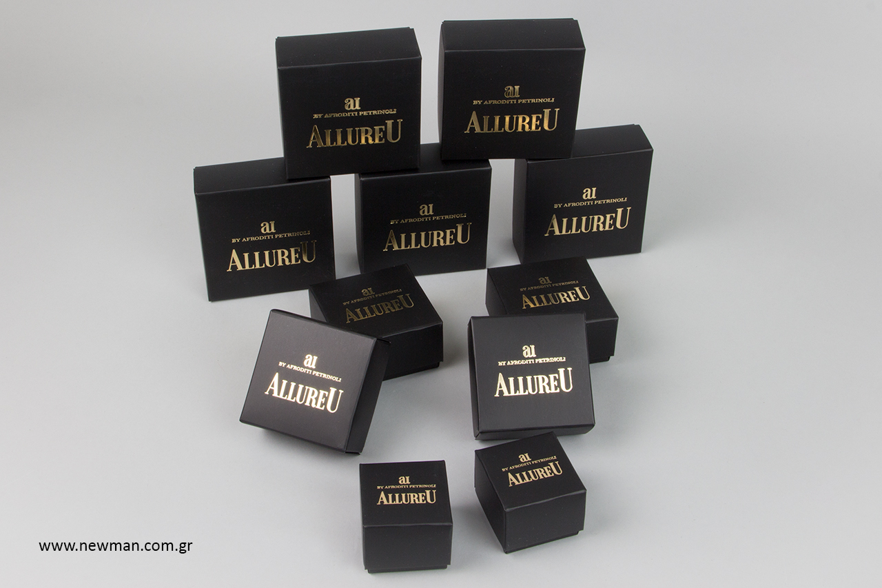 Gold hot-foil printing on small packaging boxes for bijoux.