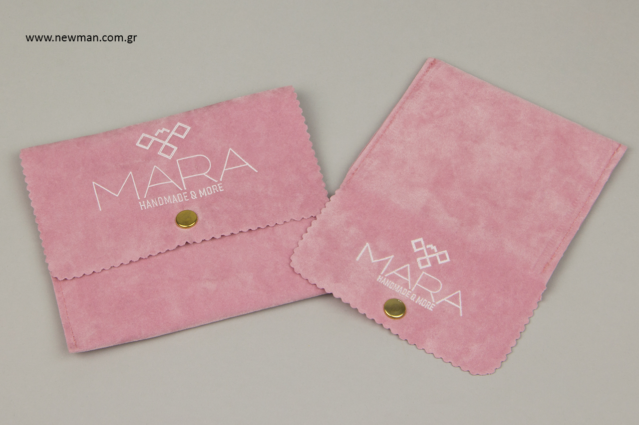 Suede pouches for jewellery with white hot-foil printing.