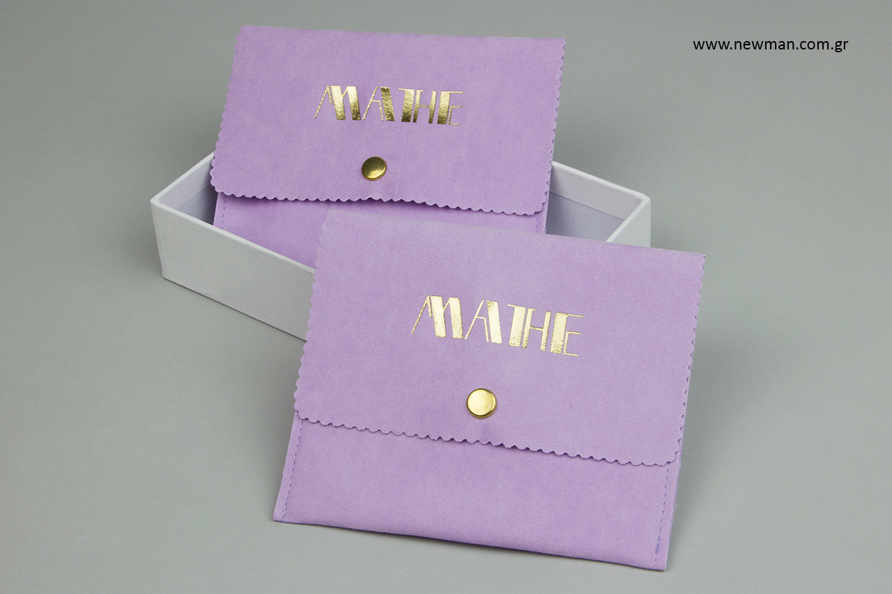 Gold hot-foil printing on lilac jewellery cases.