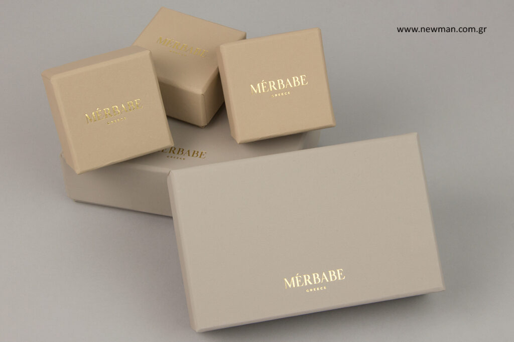 Merbabe: Gold metal printing on NewMan rigid boxes.