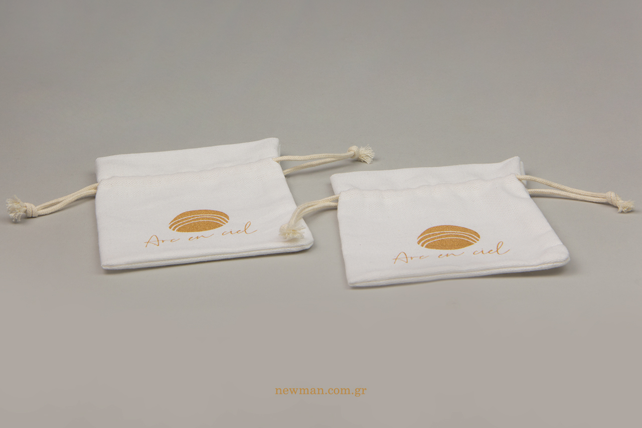 Branded cotton packaging pouches with logo.