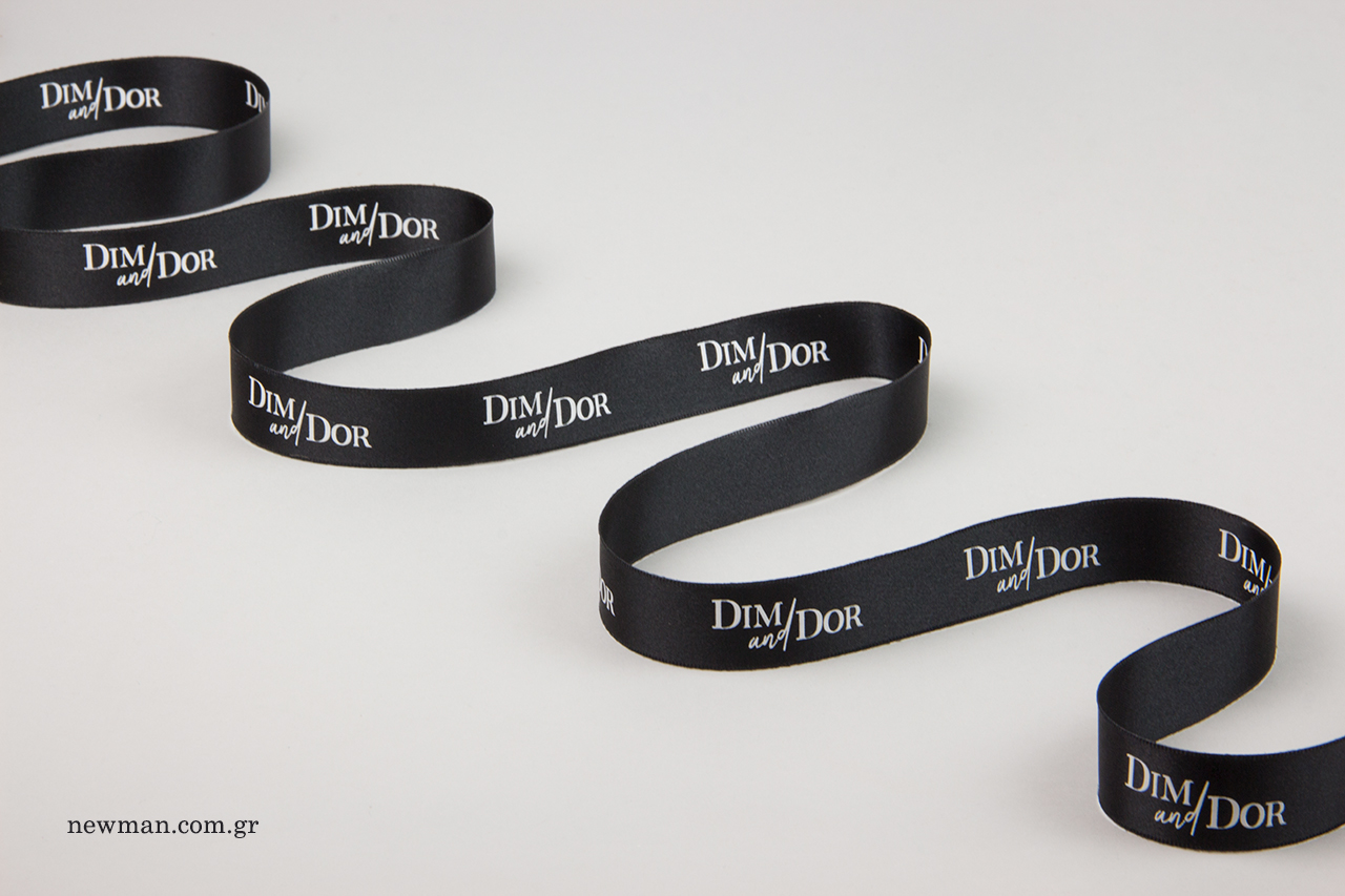 Branded packaging ribbons with white print.