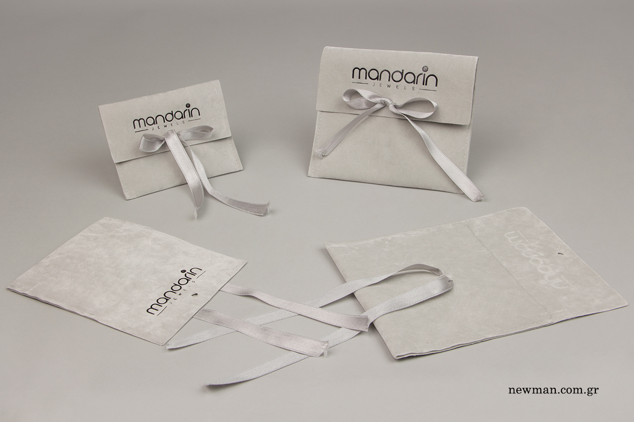 Brand name printing on suede pouches with ribbon.
