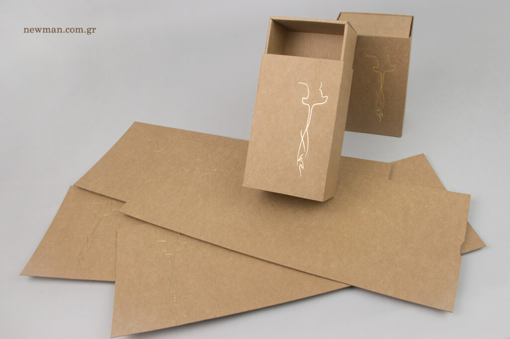 Gold hot-foil printing on Newman eco-friendly matchbox-type kraft boxes.