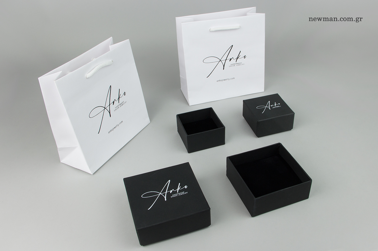 Paper bags and boxes with corporate print.