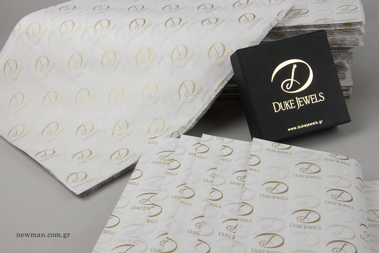 Branded jewellery packaging with company name.