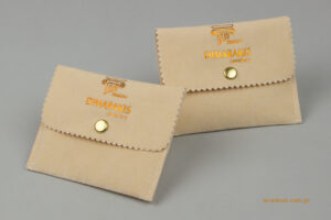 Dimarakis jewellery: NewMan packaging pouch with logo.