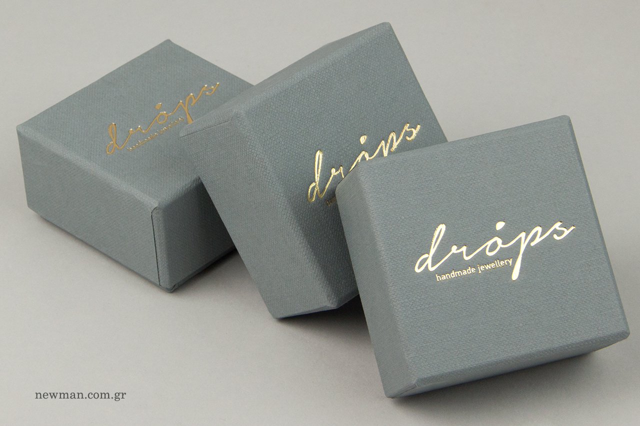 Hot-foil printing on branded packaging boxes.