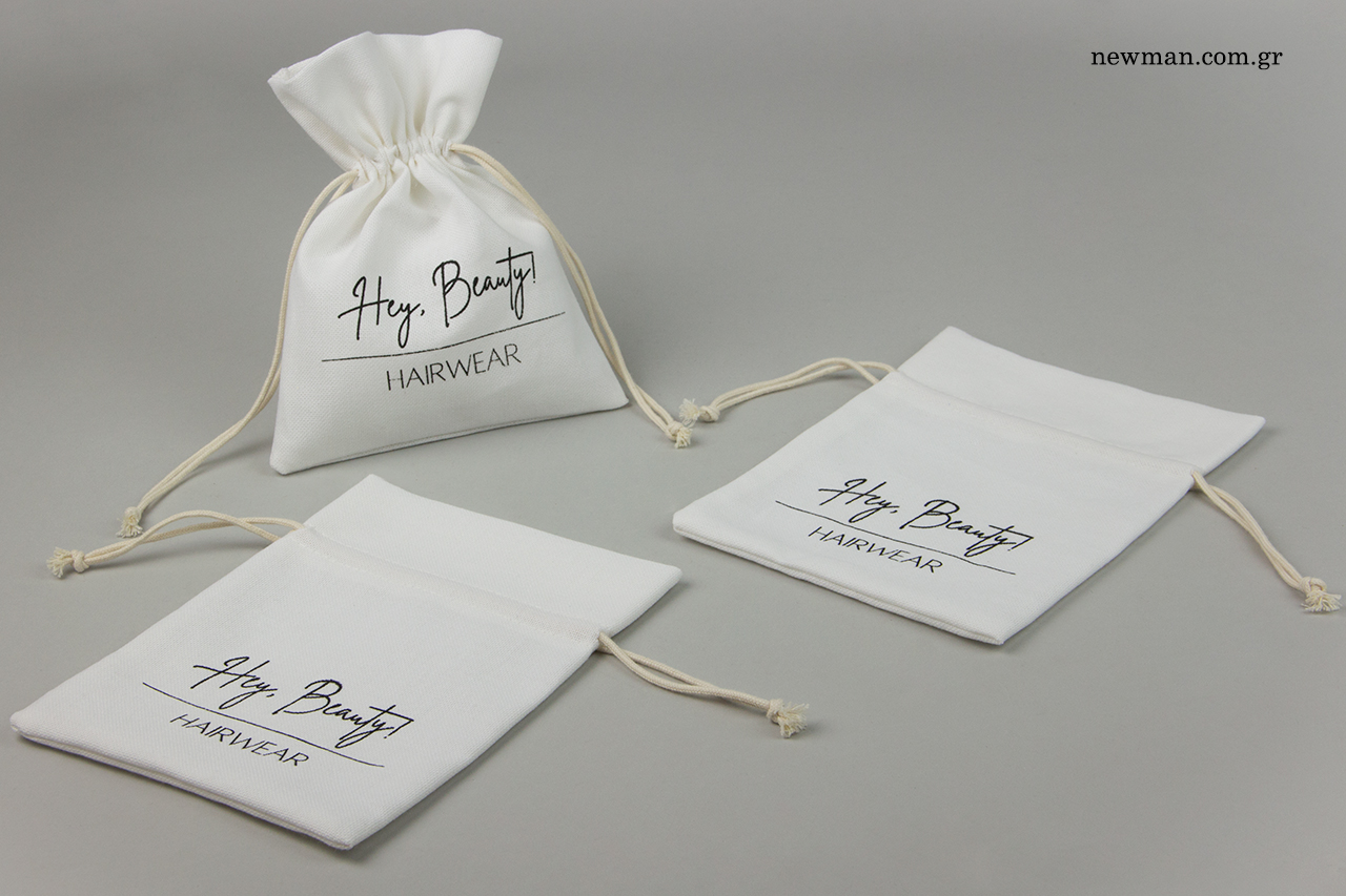 Cotton packaging pouches with brand name.