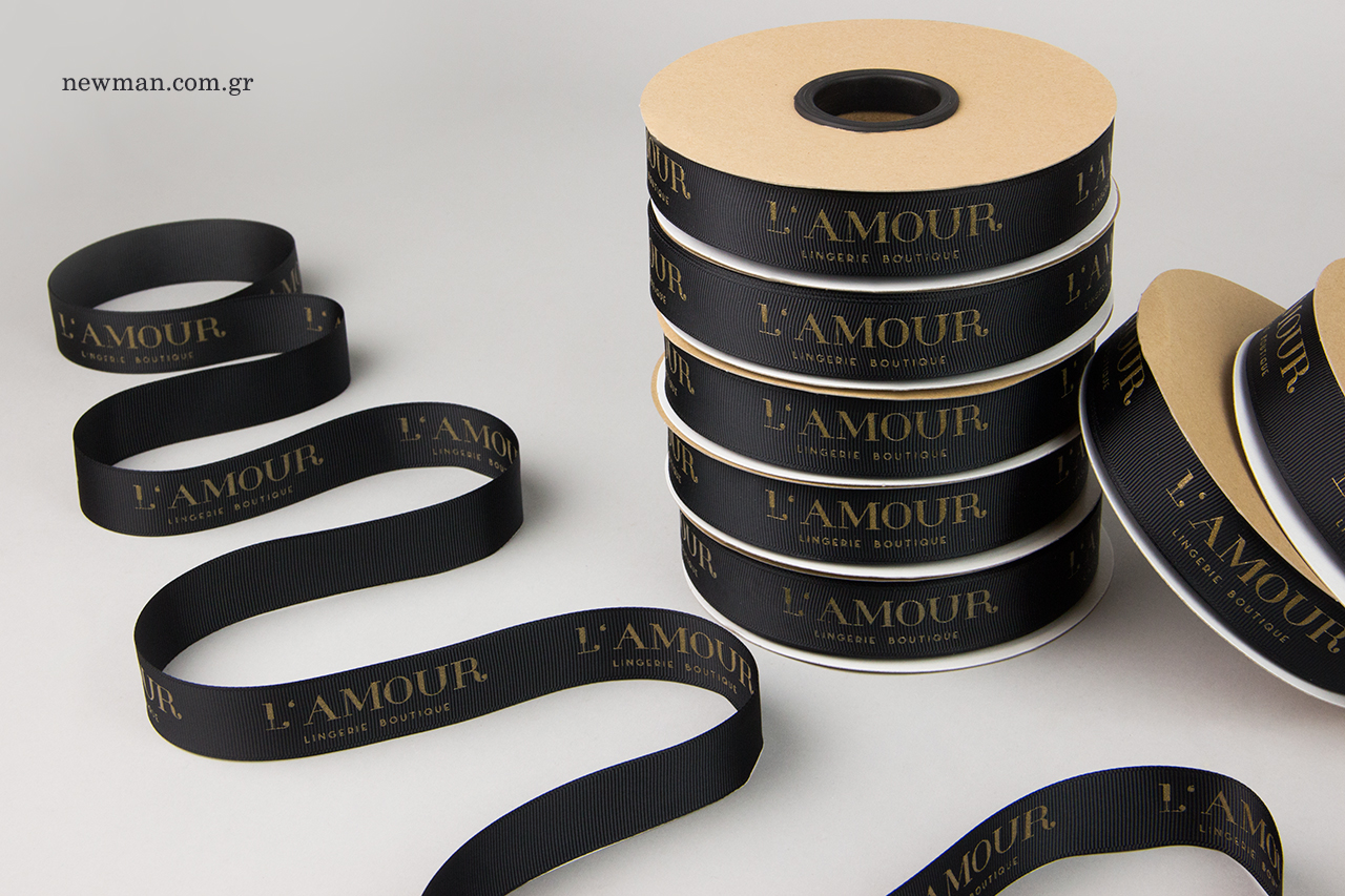 Black grosgrain ribbons with gold silk-screen printing.