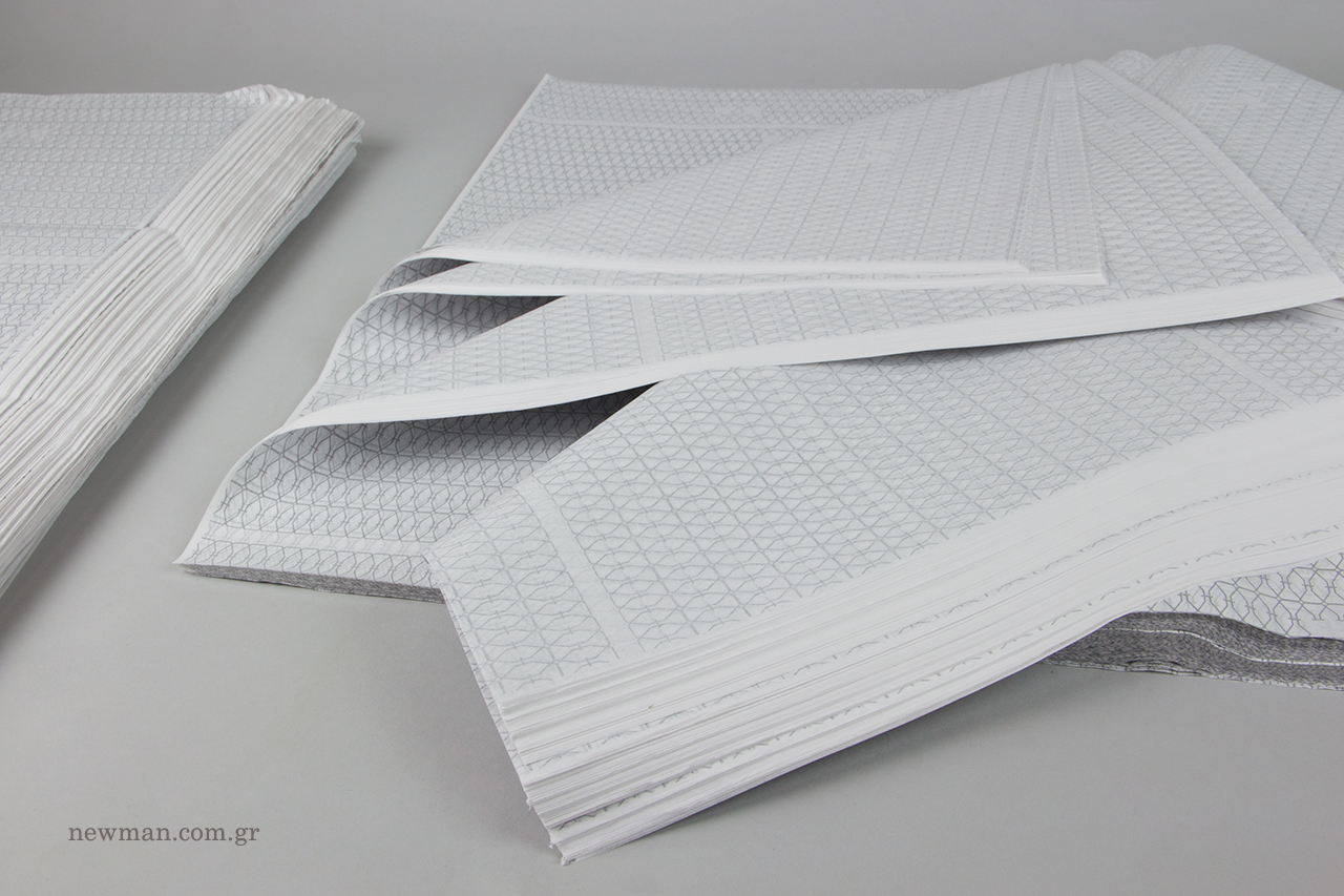 Gray flexographic printing on white tissue paper.