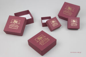 Ta Agioreitika: Gold logo on handmade boxes.