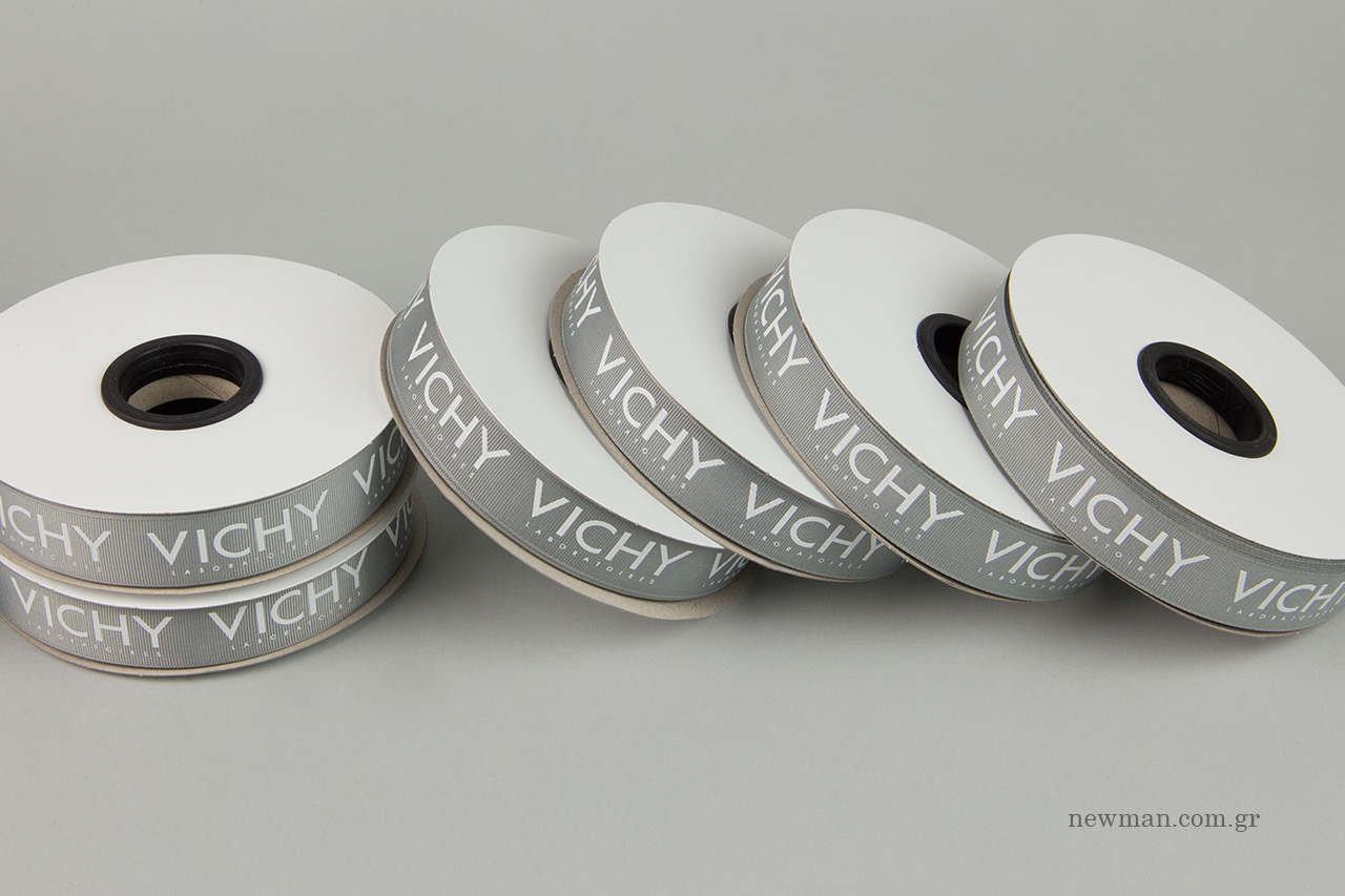Printed grosgrain ribbons with Vichy logo.