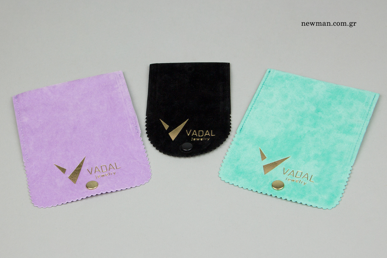 Gold hot-foil printing on suede jewelry packaging.