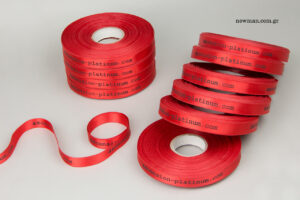 www.ascension-platinum.com: Double-sided satin ribbon with black letters.