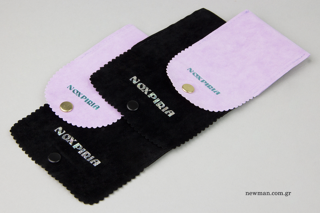 Printed logo with iridescent color on suede pouch.